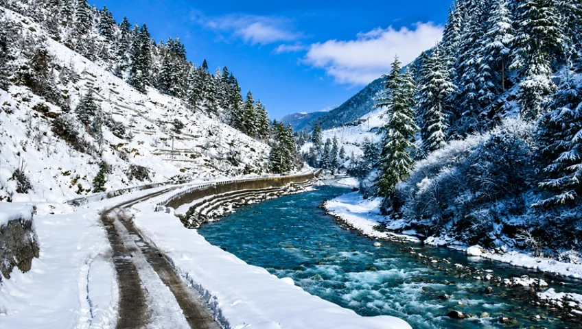 Snow-covered Kalam mountain road in Swat built with cement supplied by Ammad Trading